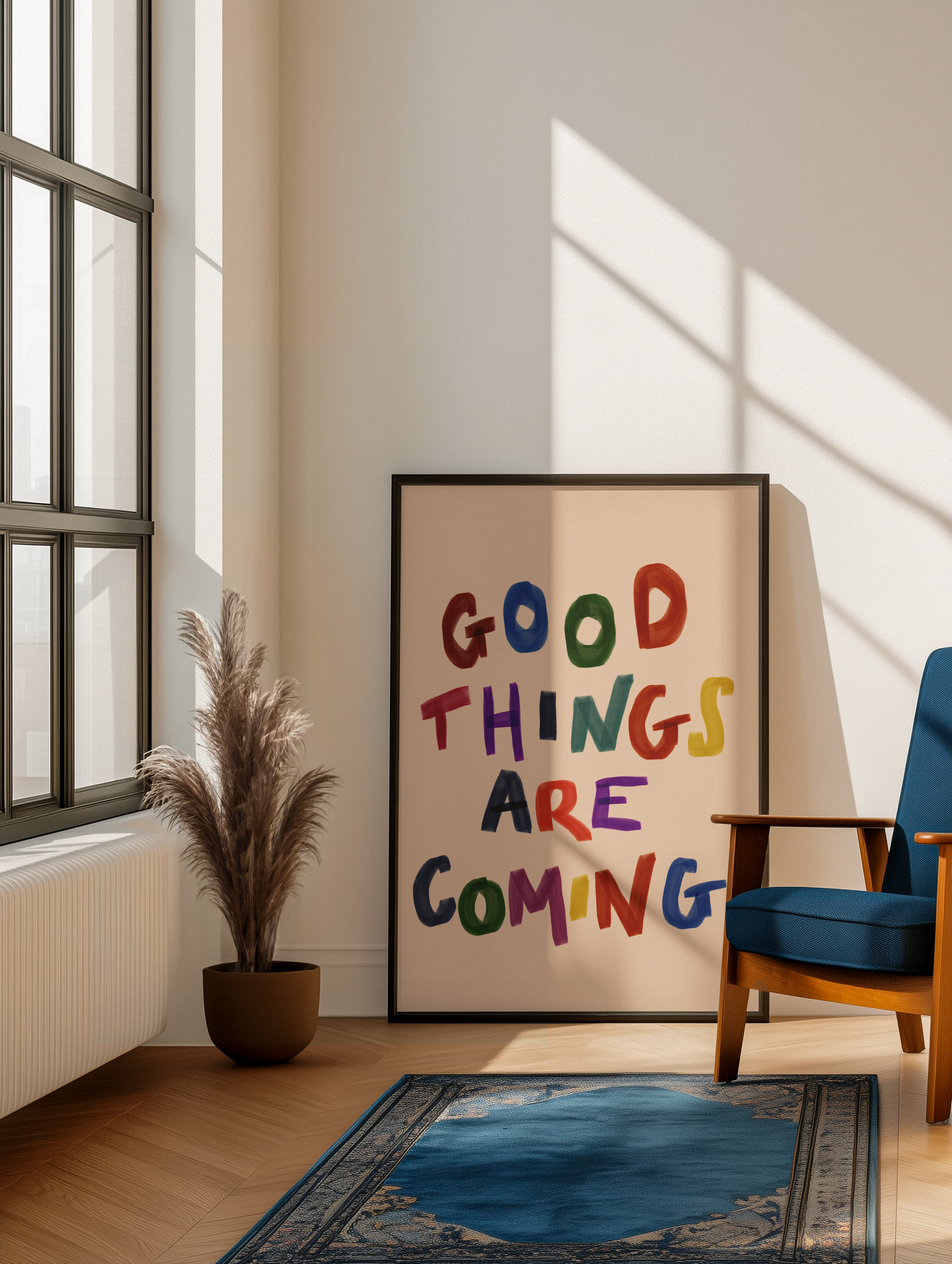 Room interior with a 'Good Things Are Coming' poster, plant, and chair.