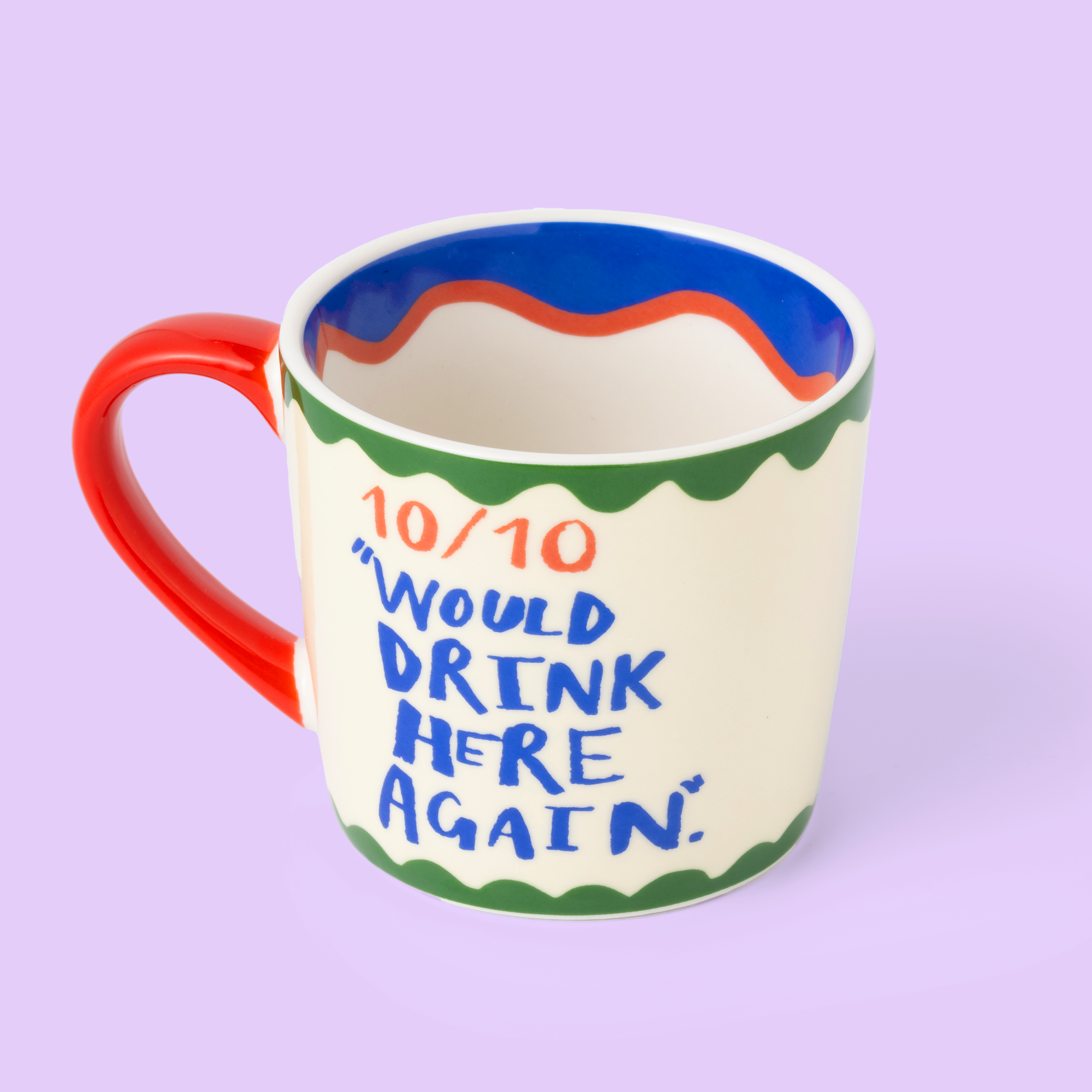 Colorful mug with text on a light purple background