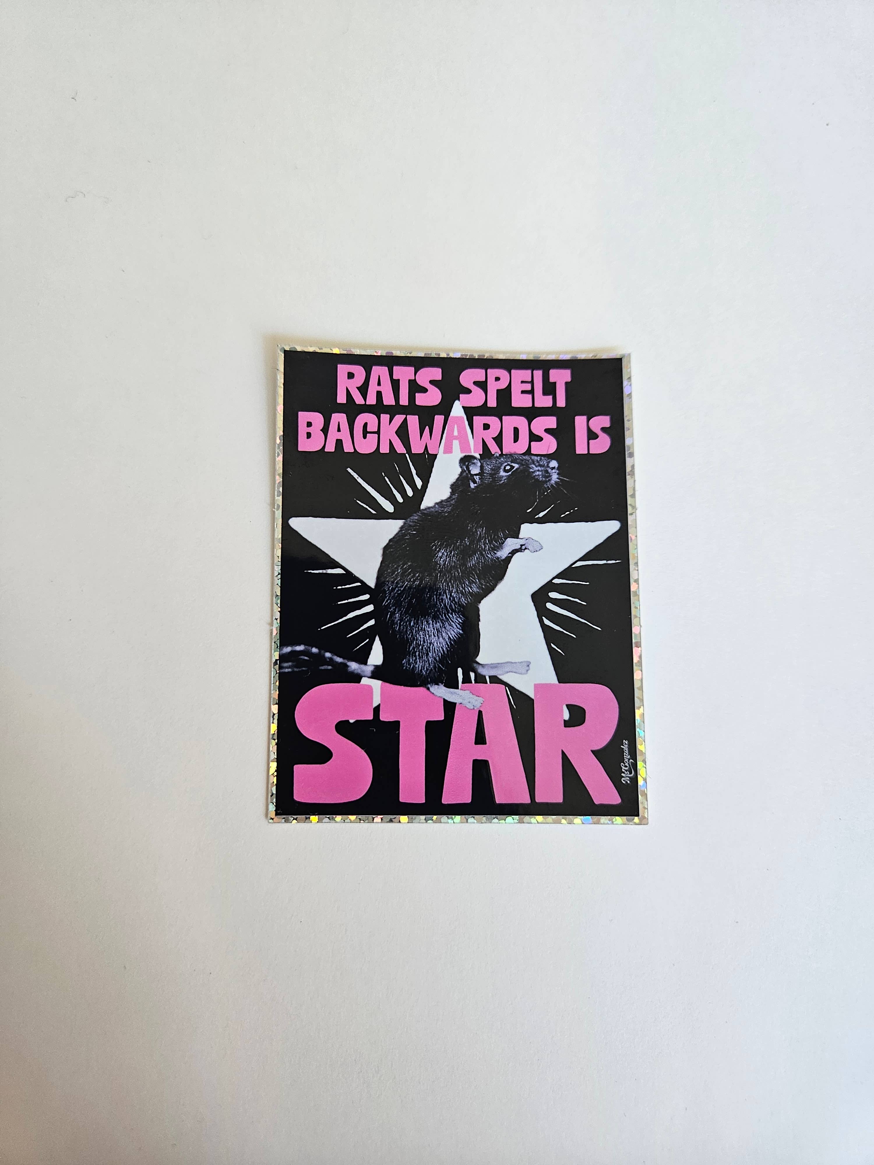 Poster with a rat illustration and text on a white wall
