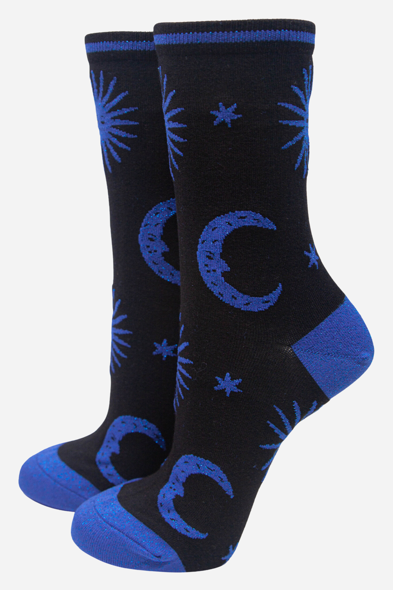 Black socks with blue moon and star patterns on a white background