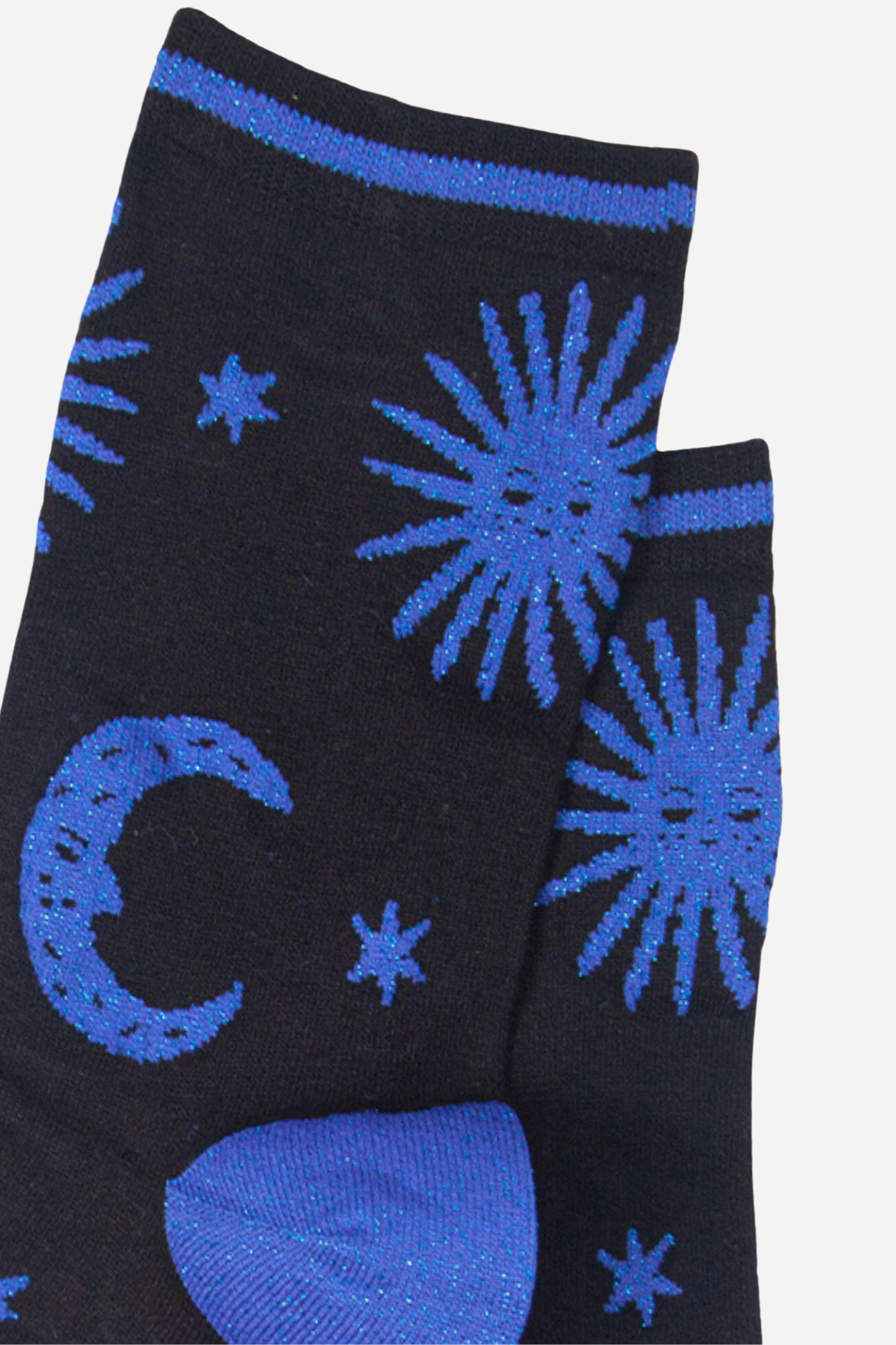 Black socks with blue celestial designs on a light gray background