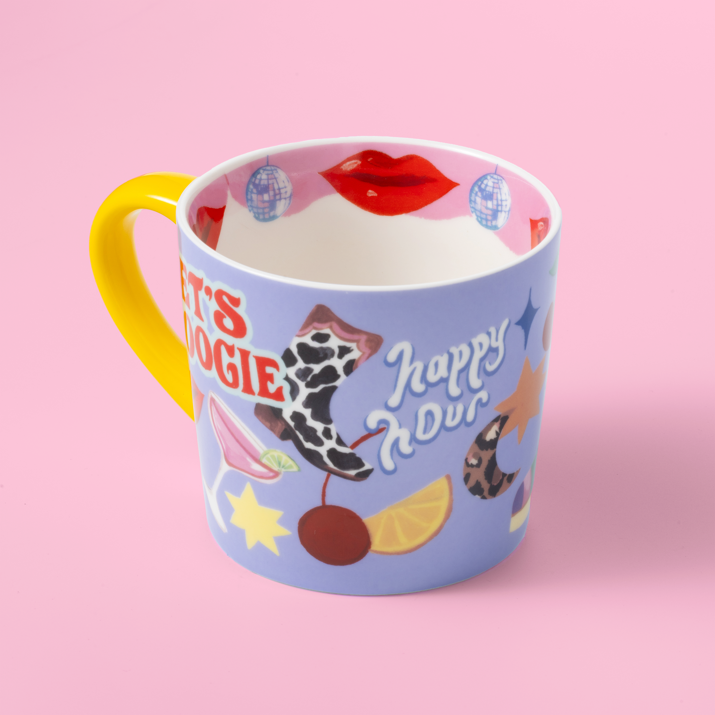 Colorful mug with cartoon designs on a pink background