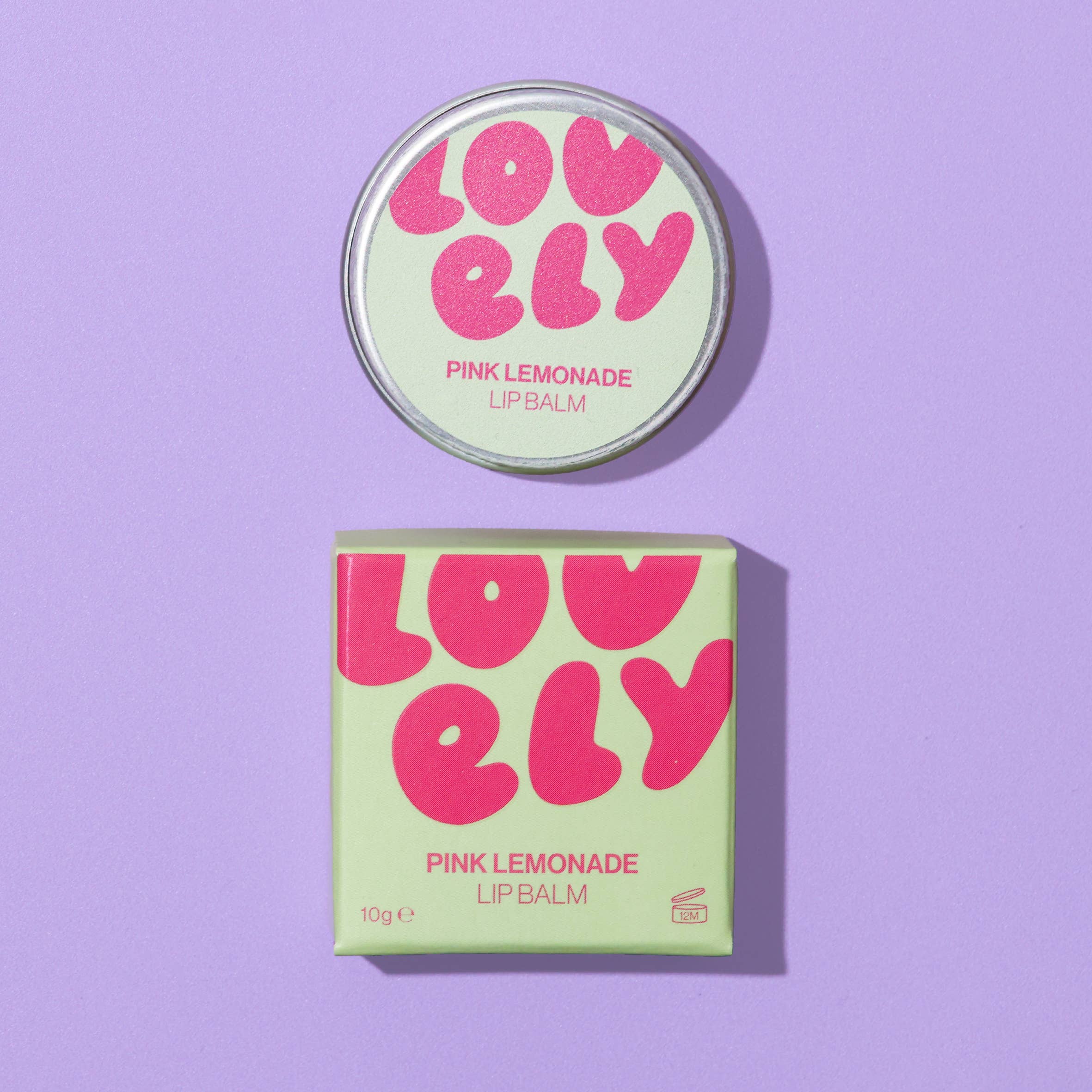 Lovely Pink Lemonade lip balm packaging on a purple background