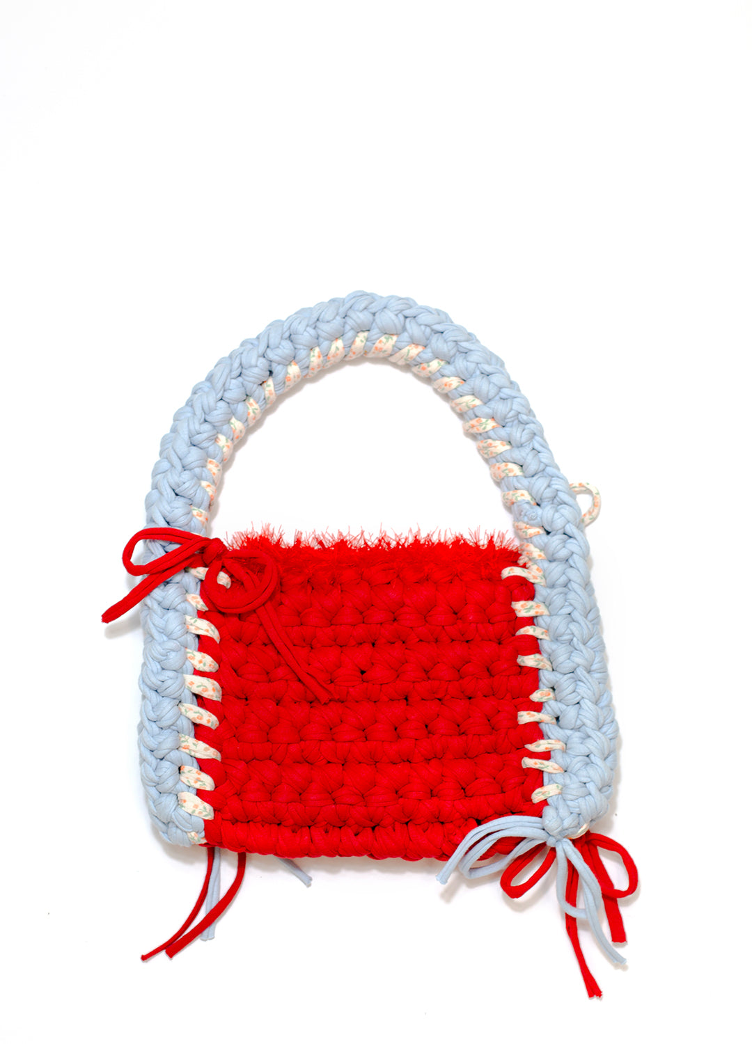Crocheted handbag with light blue handle and red body on a white background