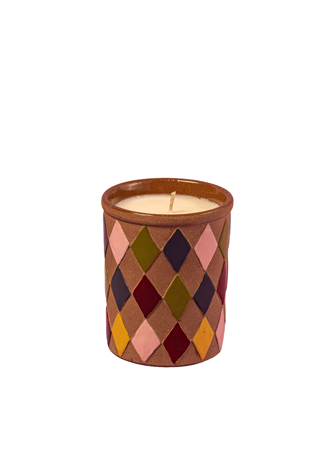 Candle in a decorative container with a geometric pattern on a white background