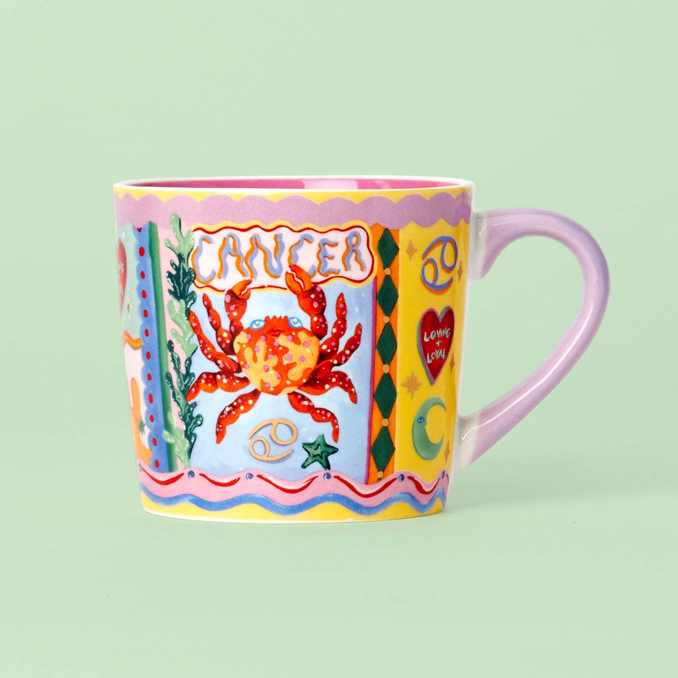 Colorful mug with a Cancer zodiac design on a light green background