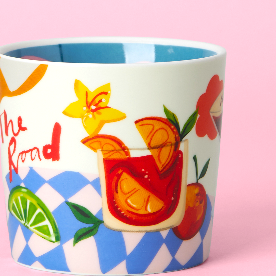 Colorful mug with a cocktail design on a pink background