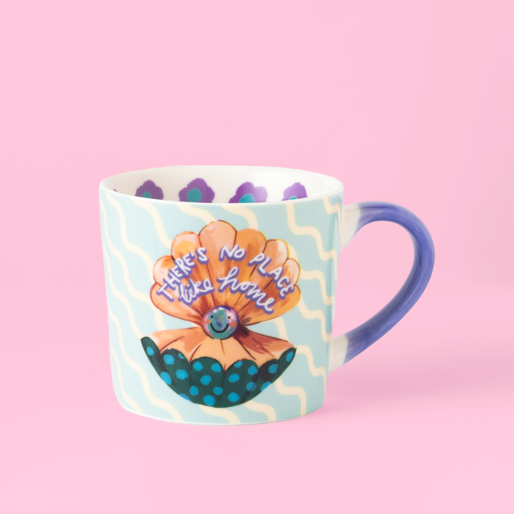 Mug with a colorful design on a pink background