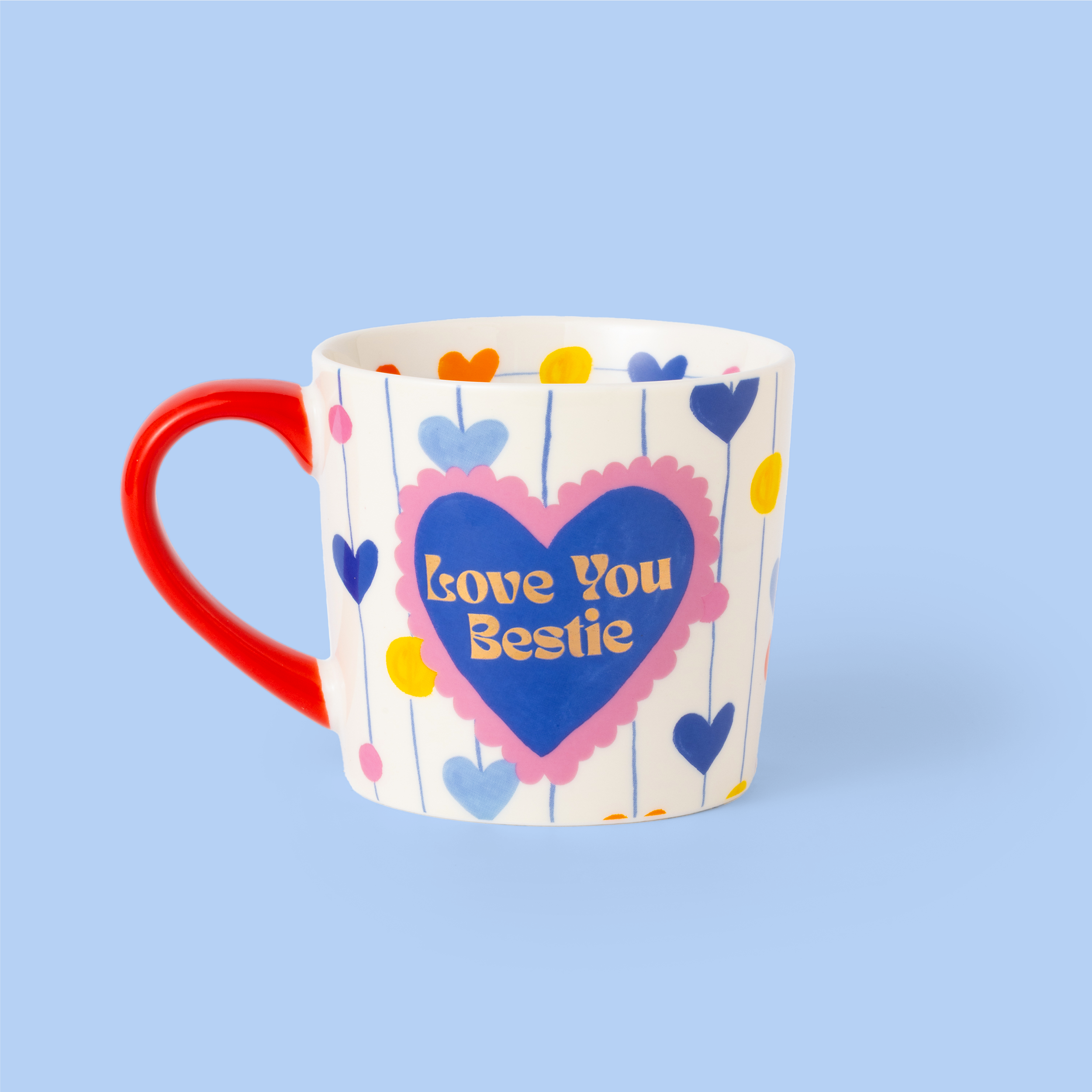 Mug with heart design and 'Love You Bestie' text on a blue background