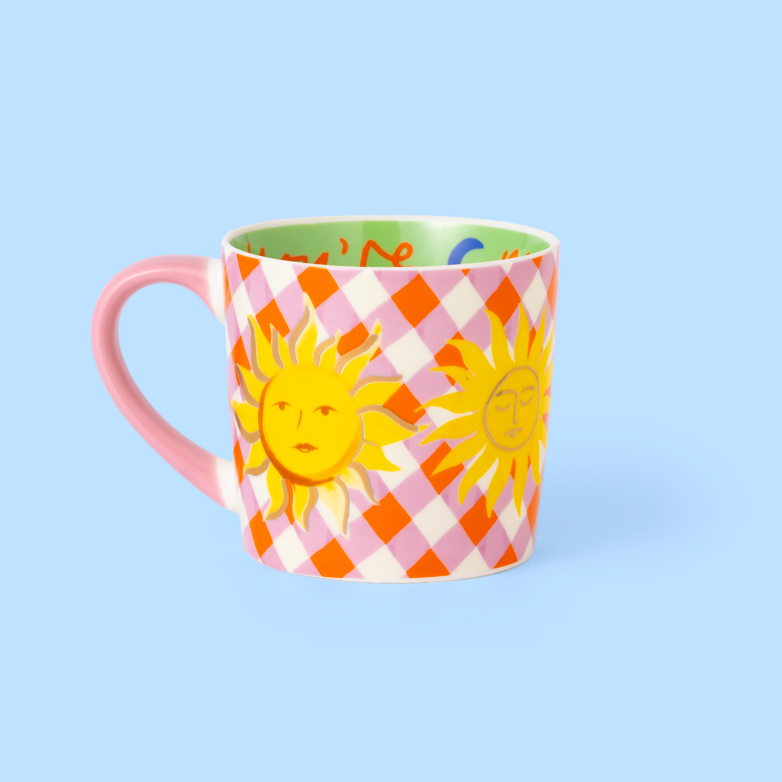 Colorful mug with sun design on a light blue background