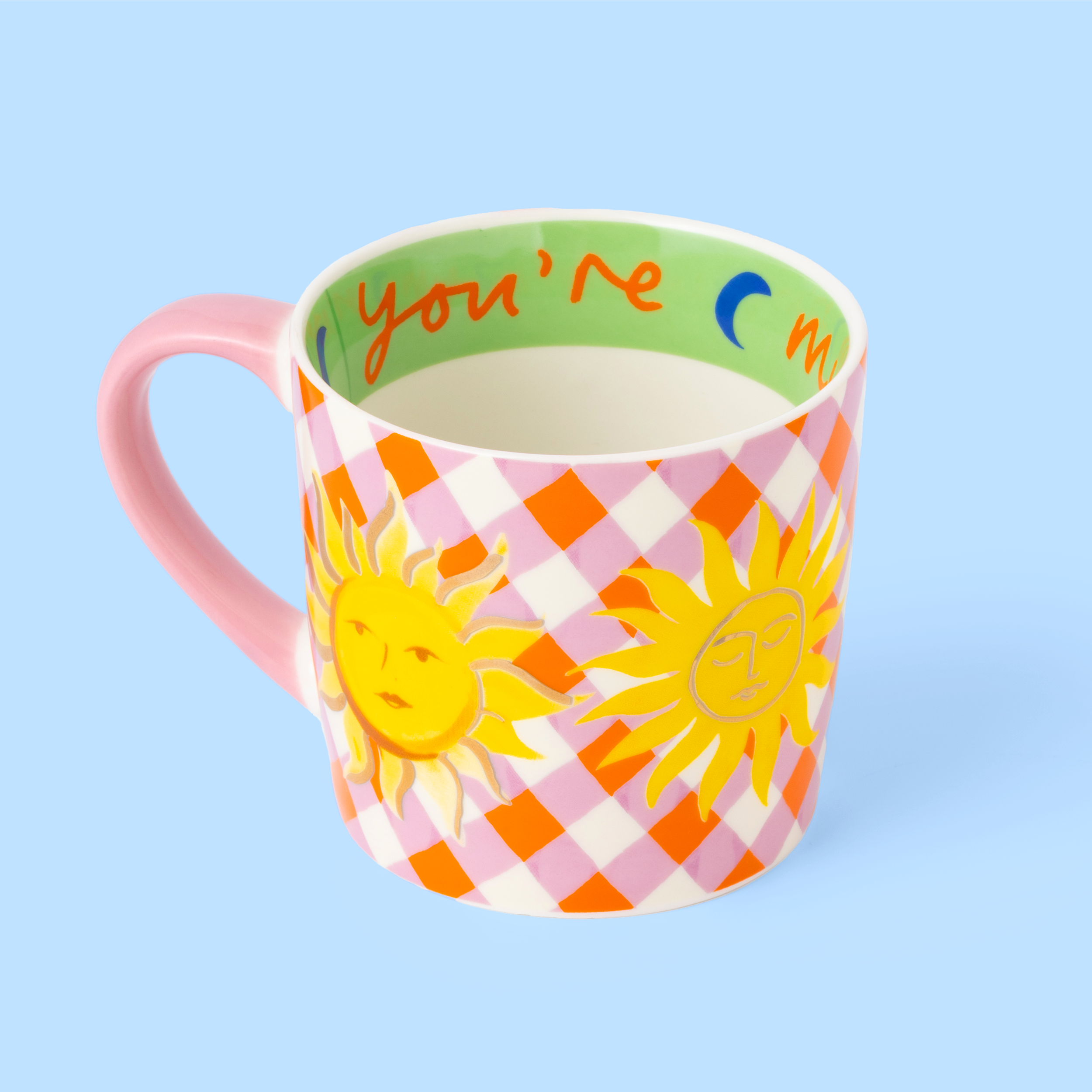 Colorful mug with sun design and checkered pattern on a light blue background