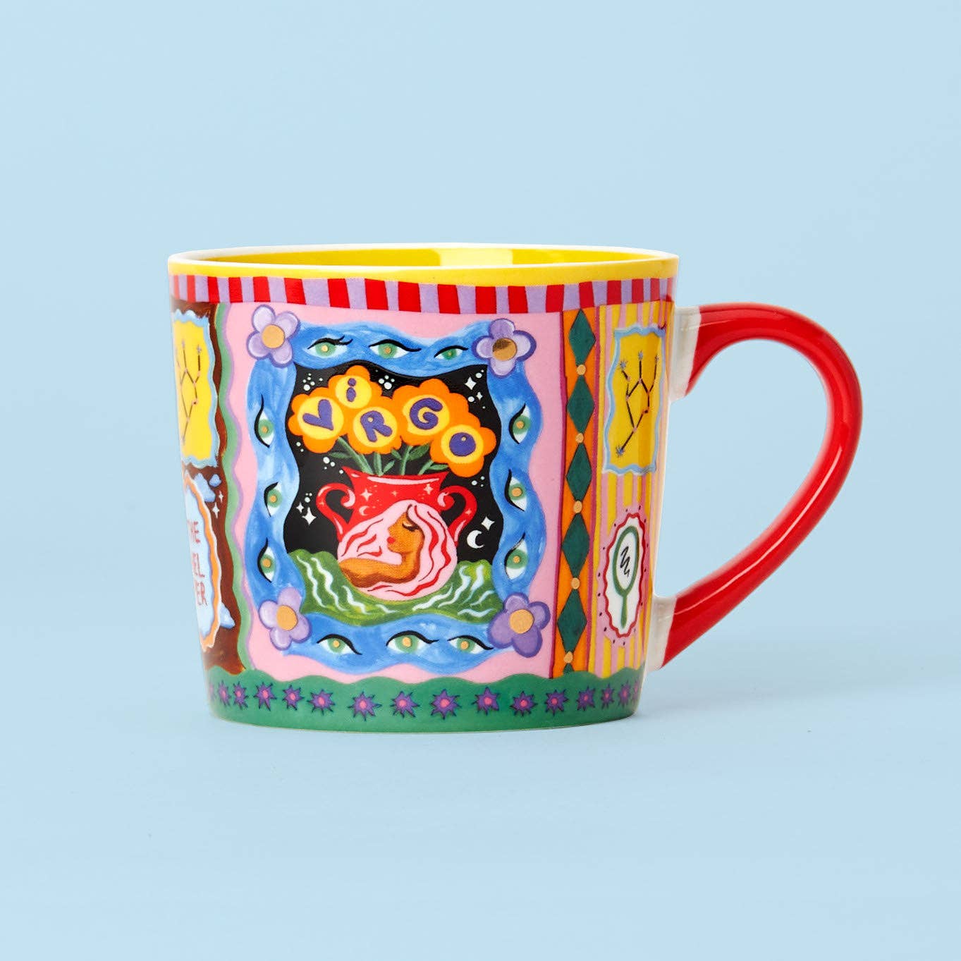 Colorful mug with artistic design on a light blue background