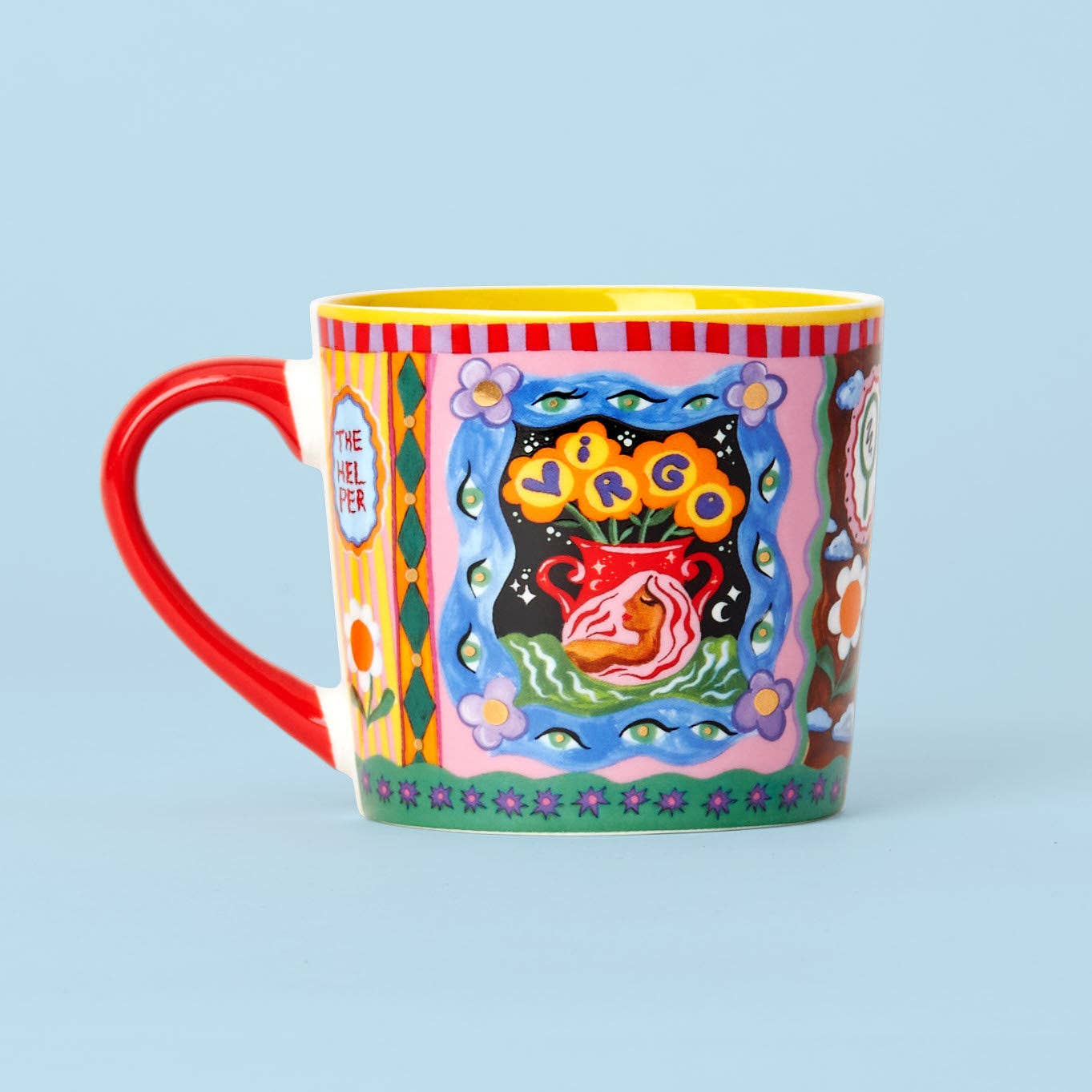 Colorful mug with artistic design on a light blue background
