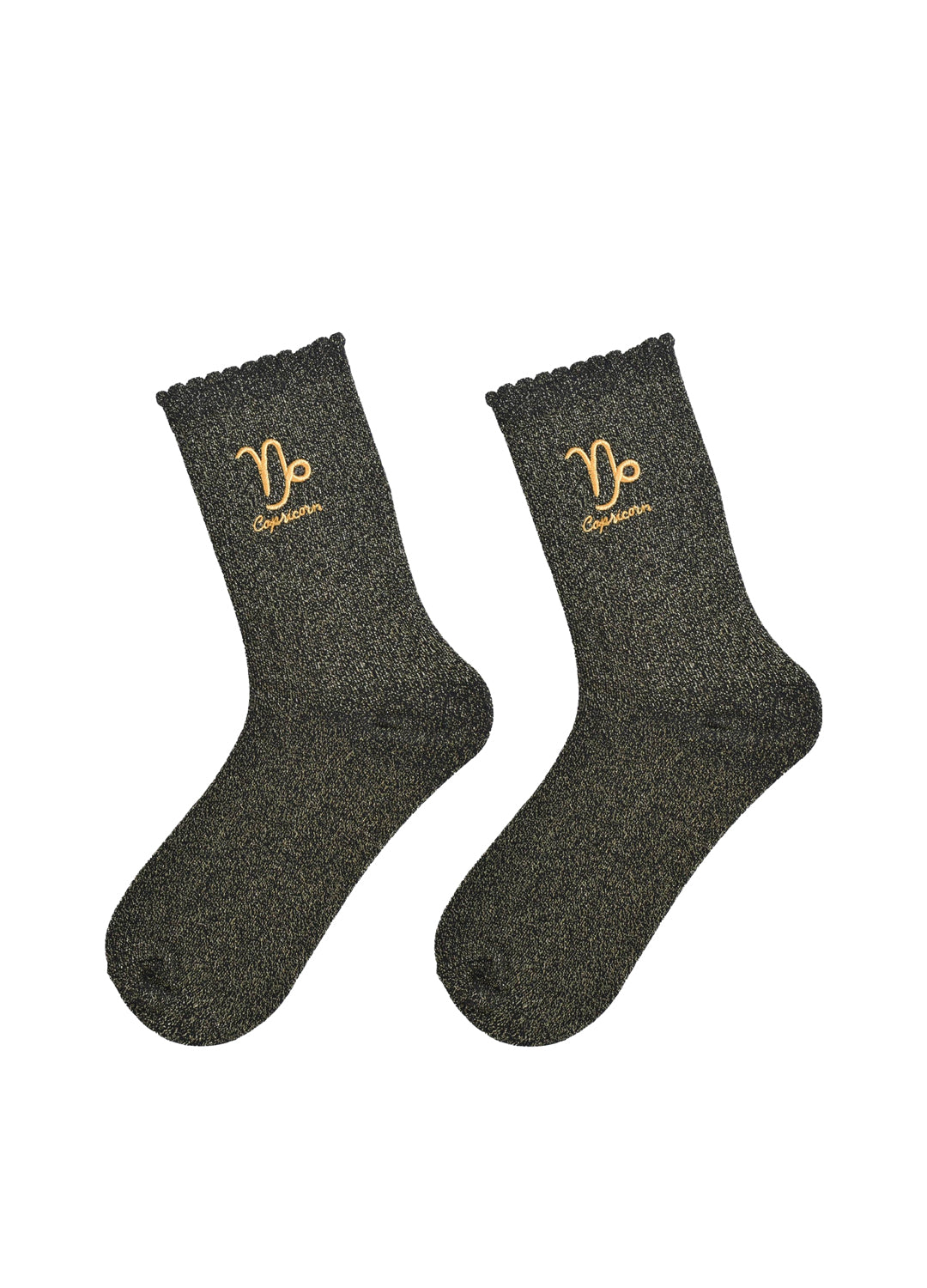 Pair of black socks with gold capricorn zodiac symbol and text on a white background