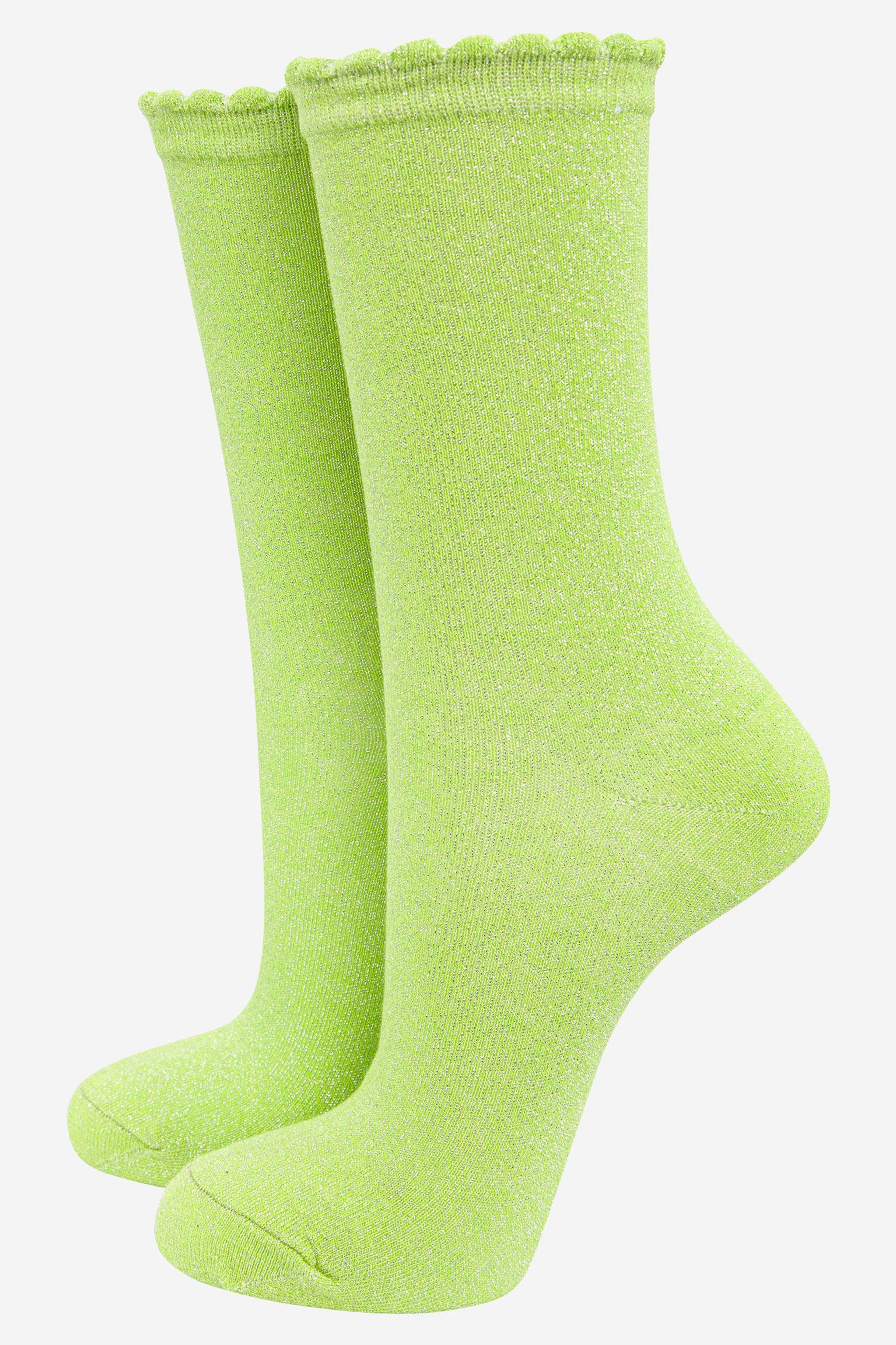 Pair of green socks on a white background