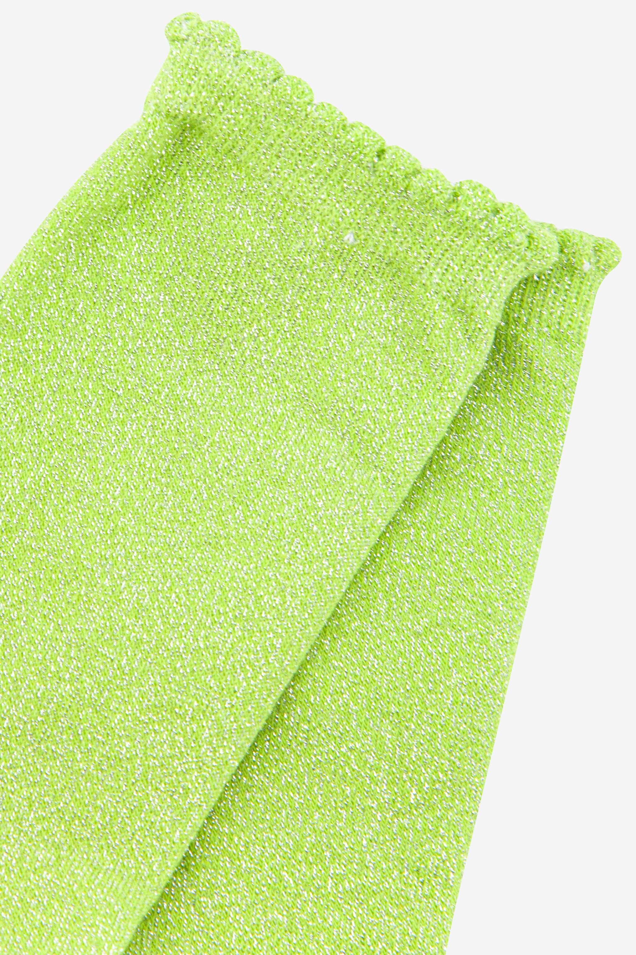 Folded green towel on a white background
