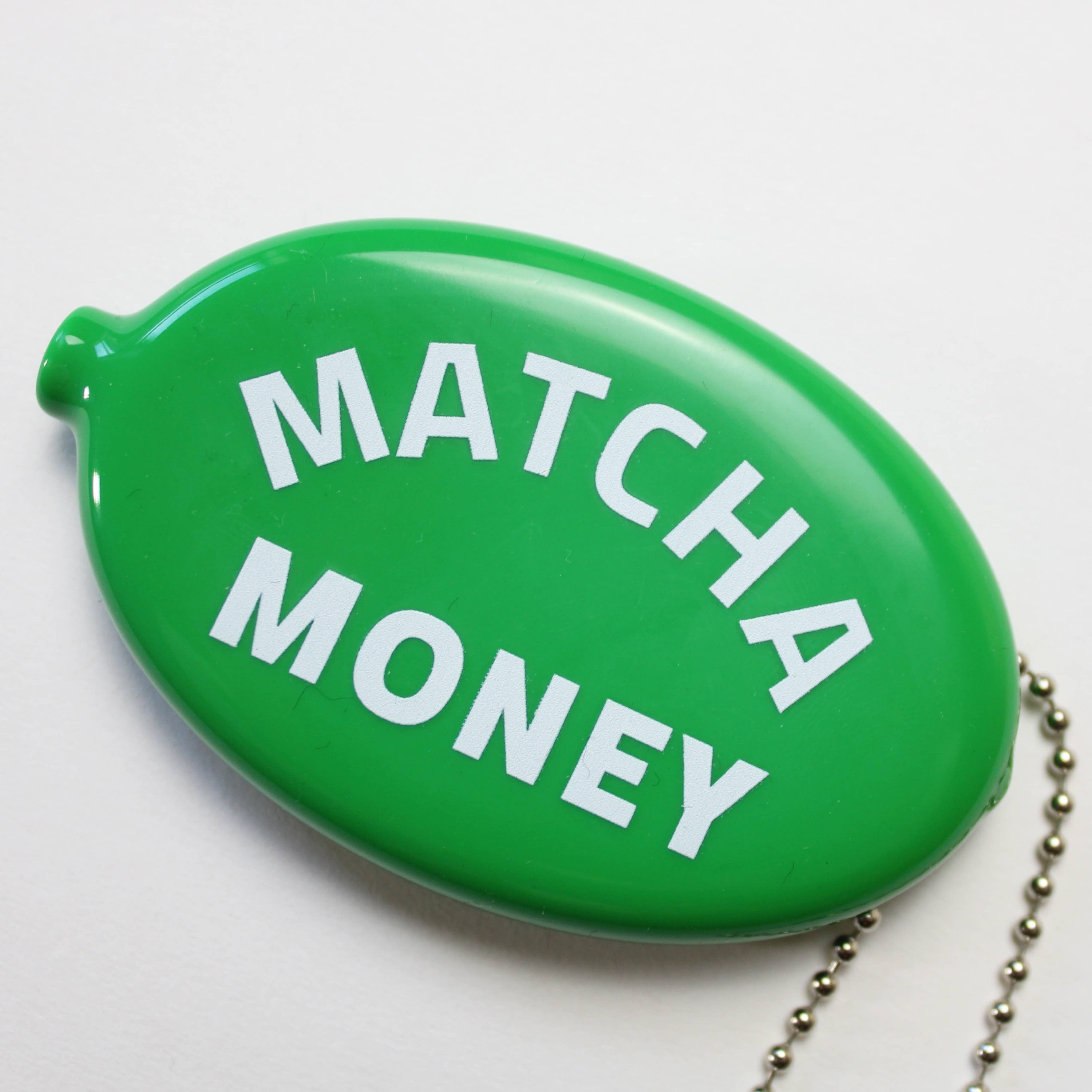Green pouch with 'Matcha Money' text on a white background