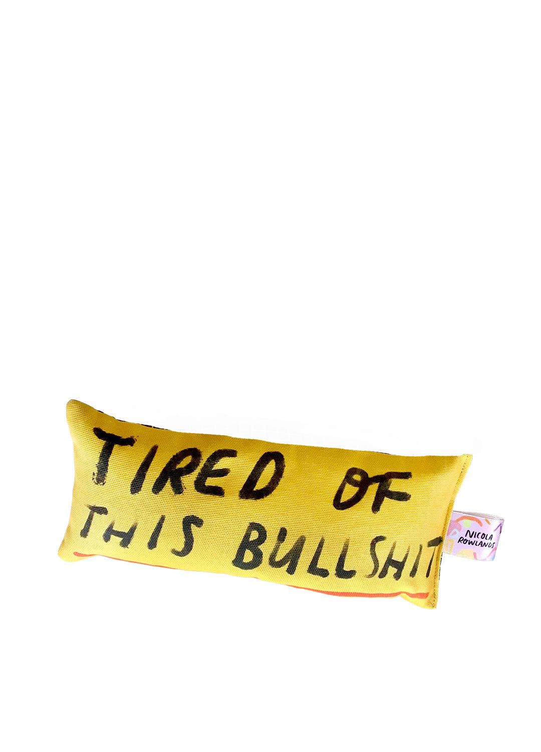 Yellow eye bag pillow with black text reading Tired of this bullshit on a white background