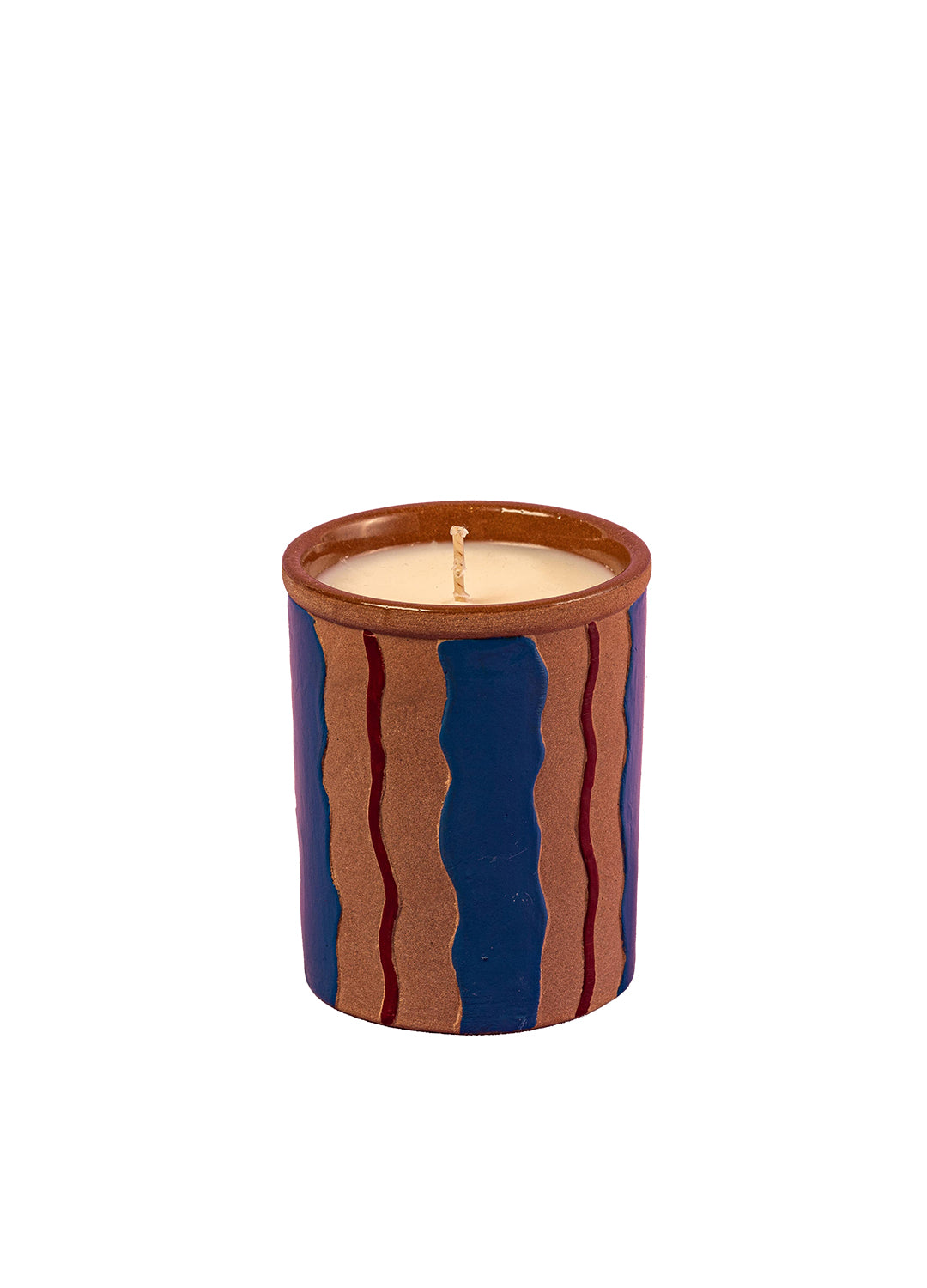 Candle in a decorative container with wavy patterns on a white background