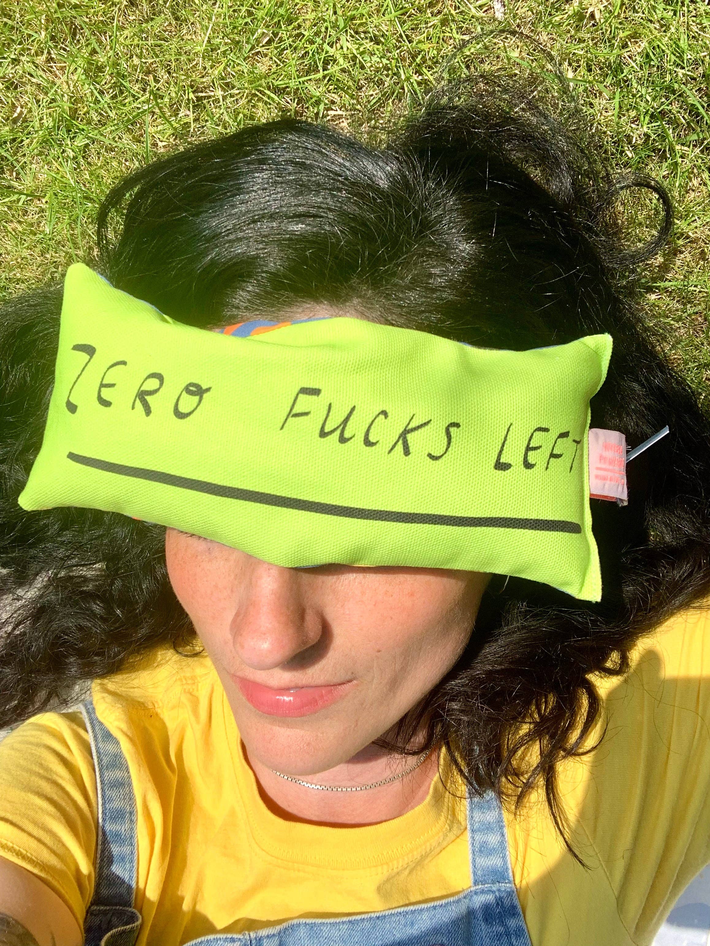 zero fucks green eye bag on someones head laid down
